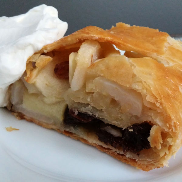 German Apfelstrudel served with whipped cream German Apfelstrudel served with whipped cream