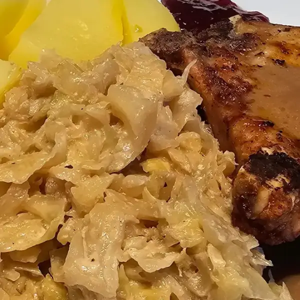 German creamed cabbage with pork and boiled potatoes