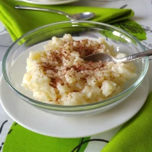 bowl of rice pudding with green napkins