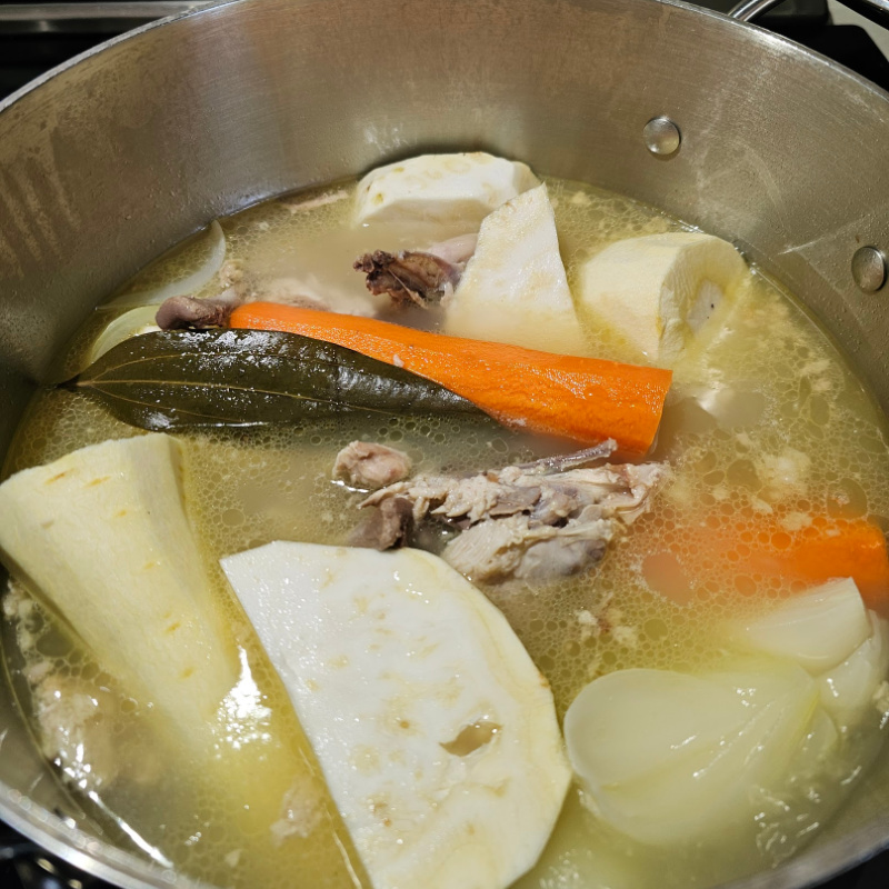 Broth being made of rotisserie chicken carcass and vegetables Broth being made of rotisserie chicken carcass and vegetables