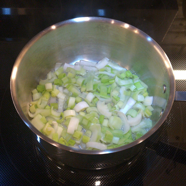 Sliced leeks cooking in a bit of water