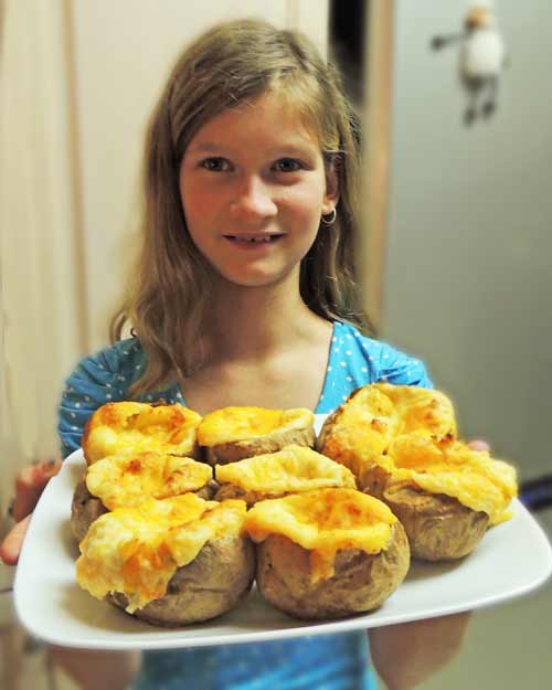Stuffed baked potatoes made by my granddaughter Lydia for the first time! My granddaughter, Lydia, and her first attempt at making twice baked potatoes.