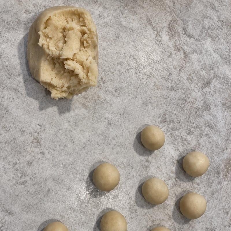 Pinch off a small portion of dough and roll it into small balls German Marzipan Potatoes Step 6