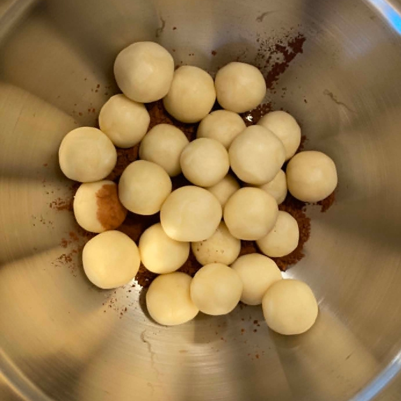 Add the balls to the bowl of cocoa powder German Marzipan Potatoes Step 7