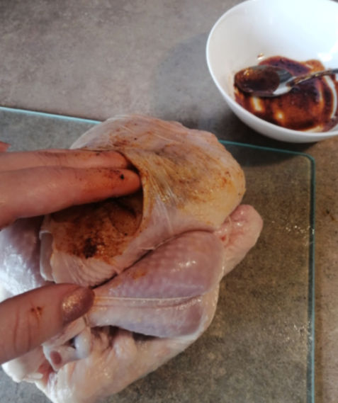 Be sure to add your mixture in between the skin and the meat for extra flavor! But don't forget your gloves for this task!