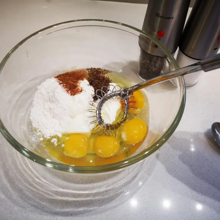Mixing the custard filling for the onion tart Mixing the custard filling for the onion tart