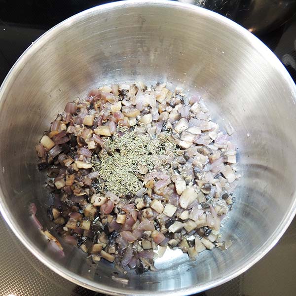 Add the seasonings; in this case, thyme, salt, and pepper.