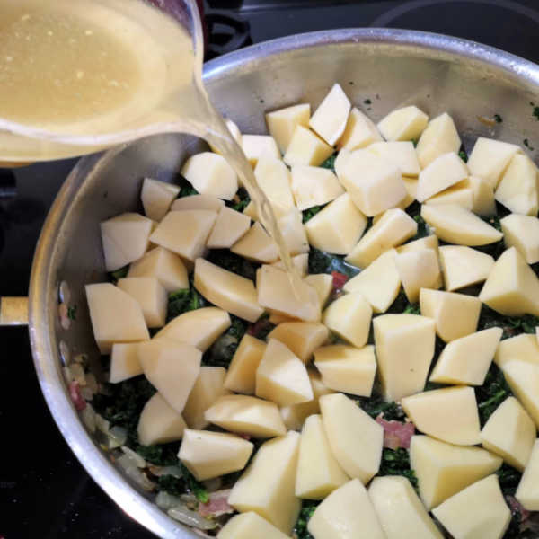 Add potatoes and broth to the pot to make Oma's Kale and Potato Recipe ~ Grünkohl mit Kartoffeln, made the easy way, all in one pot. Similar to Grünkohl mit Pinkel! Add potatoes and broth to the pot to make Oma's Kale and Potato Recipe ~ Grünkohl mit Kartoffeln, made the easy way, all in one pot. Similar to Grünkohl mit Pinkel!