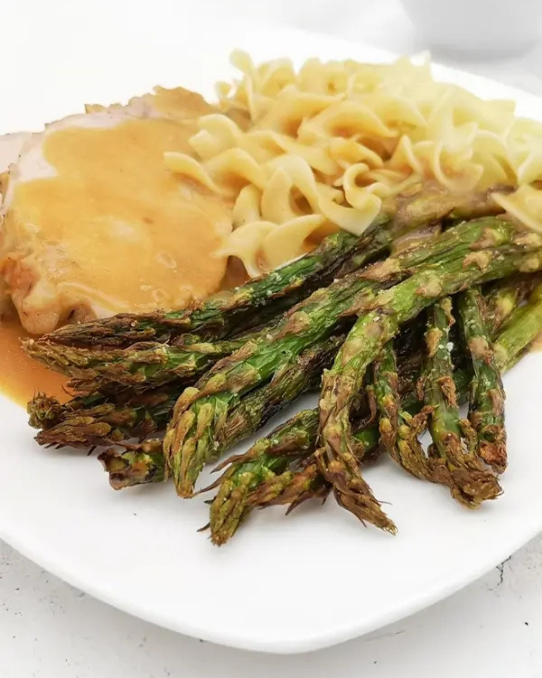 roasted asparagus with noodles, roast pork and gravy