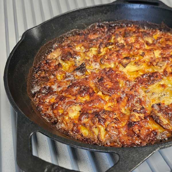 Scalloped potatoes in cast iron pan