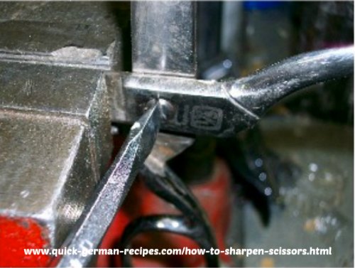 Here's how to make a screw hinged joint on scissors