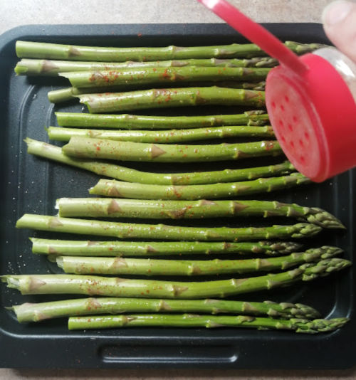 Adding some of my favorite spices and seasonings to my yummy asparagus before popping them into the fryer! Adding some of my favorite spices and seasonings to my yummy asparagus before popping them into the fryer!