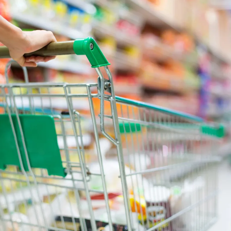Shopping cart in a grocery store aisle