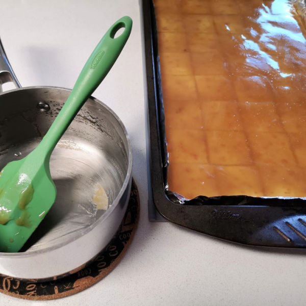 Prepping for making Skor Bar Cookies ... spread out the toffee layer carefully. It's hot! Prepping for making Skor Bar Cookies ... spread out the toffee layer carefully. It's hot!