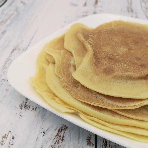 A stack of pancakes ready to make Flädlesuppe, a German pancake soup recipe. A stack of pancakes ready to make Flädlesuppe, a German pancake soup recipe.
