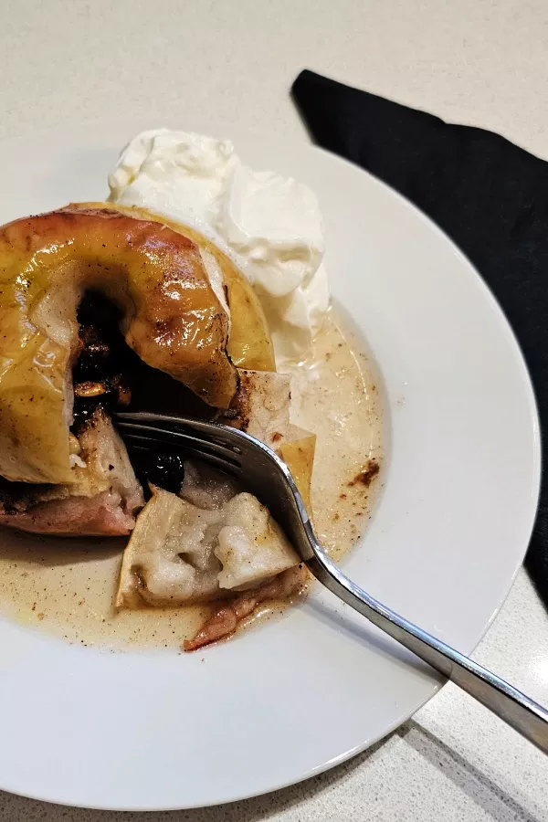 Serving baked apples with whipped cream