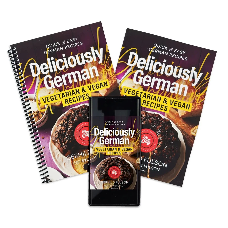 Deliciously German Vegetarian & Vegan Recipes shown as spiral book, paperback, and ebook on a phone