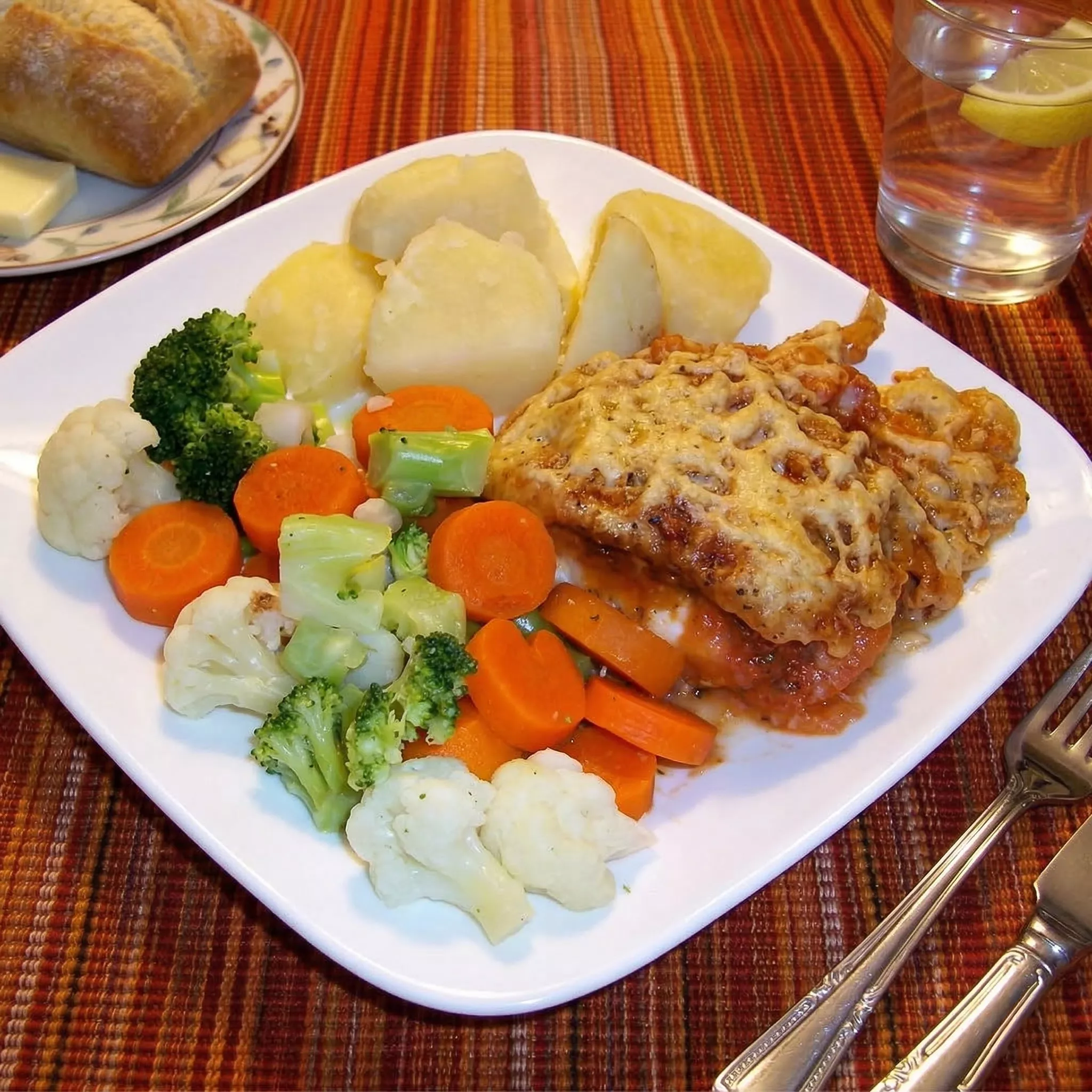 baked fish au gratin on white plate