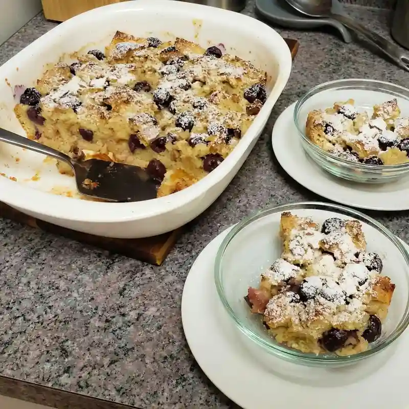 bowls of oma's delicious bread pudding with cherries
