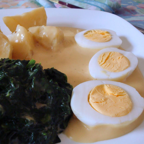 German Eggs with mustard sauce. Usually served with boiled potatoes & creamed spinach.