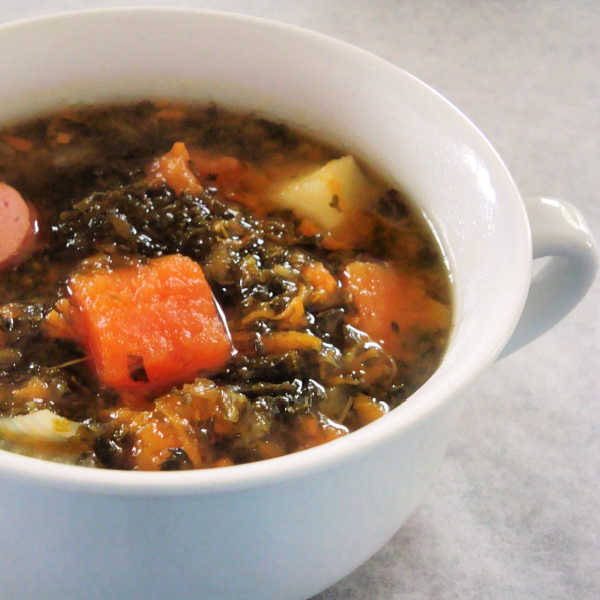 This German kale and sausage soup, Grünkohl und Wurstsuppe, is perfect for when you're wanting down-home goodness. It's the kind Oma made for any meat-and-potato lover!