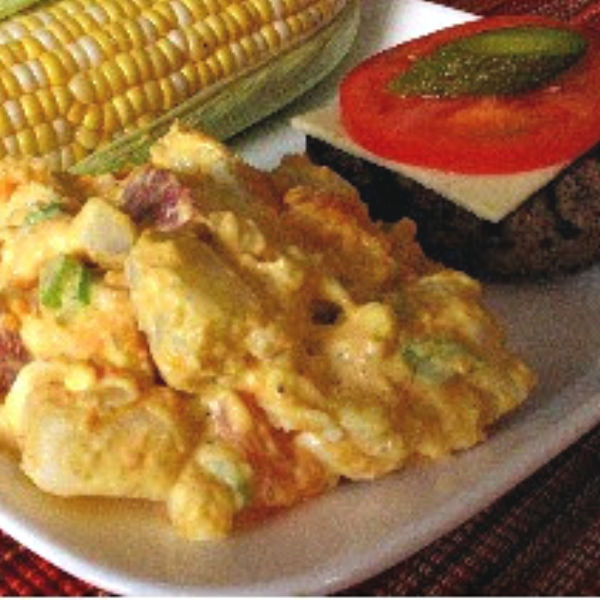 Regular and sweet potatoes grace this delicious potato salad, made just like Oma.