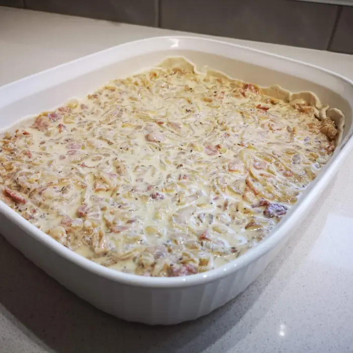 Zwiebelkuchen ready for the oven Zwiebelkuchen ready for the oven